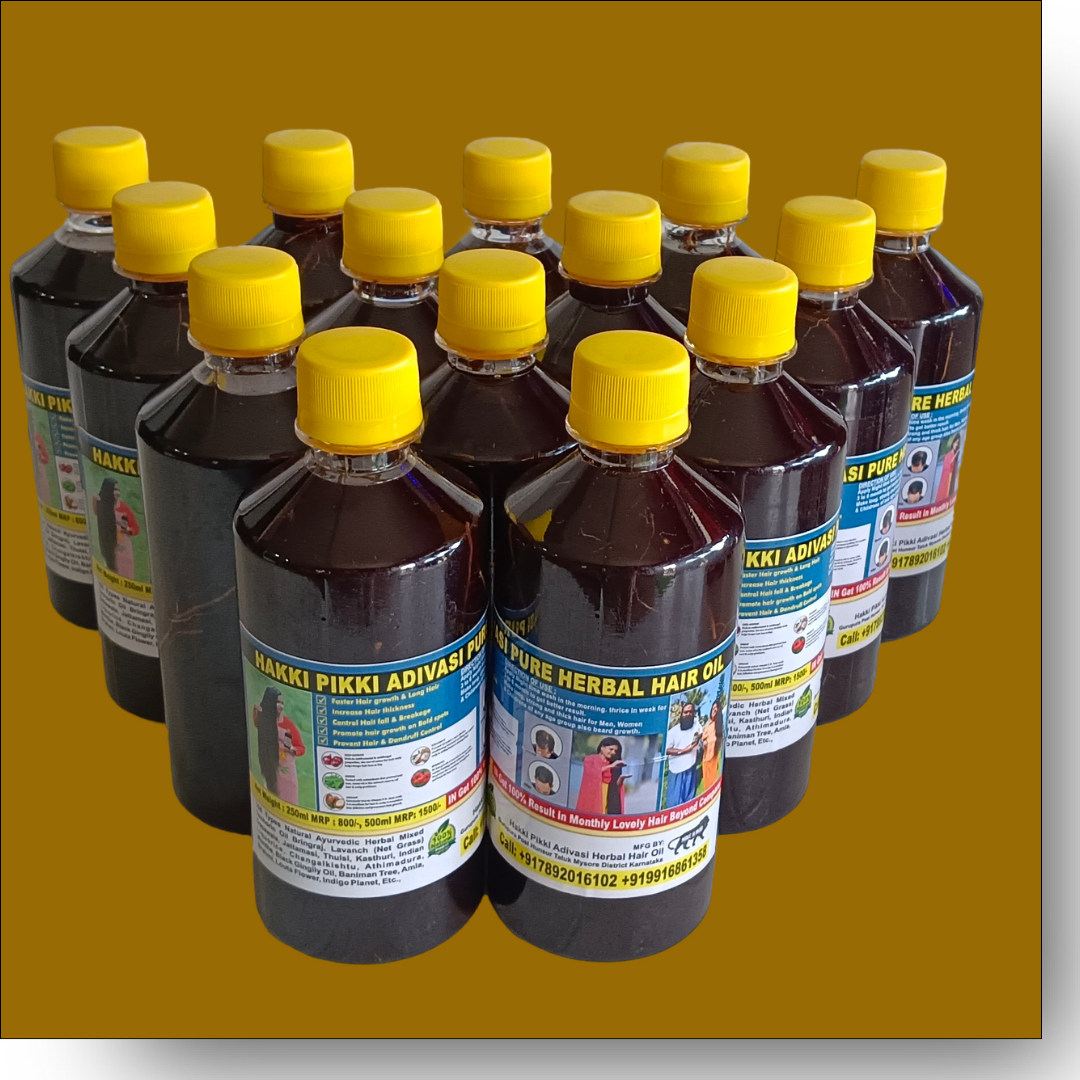 Multiple bottles of Hakki Pikki Adivar herbal hair oil with yellow caps on a yellow background