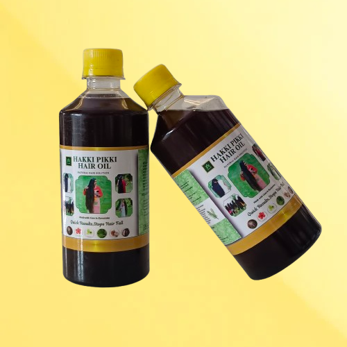 Two bottles of Hakkipikki hair oil on a yellow background