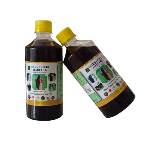 Two bottles of Haki Pikki hair oil with labels on a white background